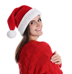 Pretty woman in Santa hat and red sweater on white background