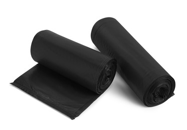 Rolls of different garbage bags on white background. Cleaning supplies