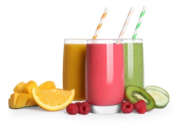 Photo of Glasses with delicious smoothies and ingredients on white background