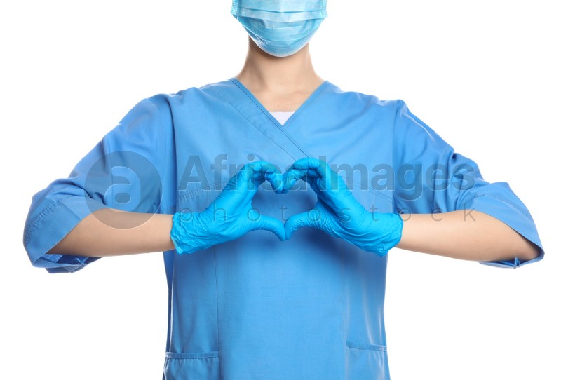 Doctor showing heart on white background, closeup