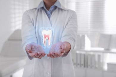 Dentist showing virtual model of tooth in clinic, closeup