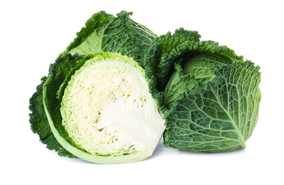 Whole and cut fresh savoy cabbages on white background