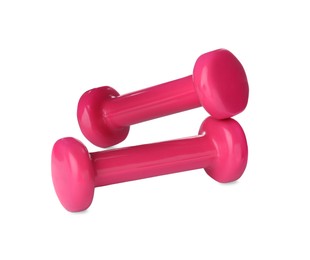 Photo of Pink dumbbells on white background. Weight training equipment