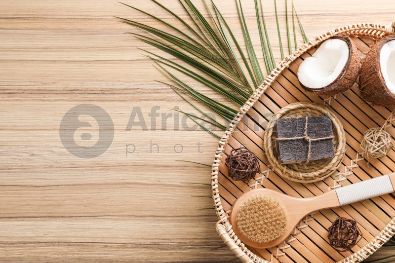 Flat lay composition with handmade soap on wooden background. Space for text