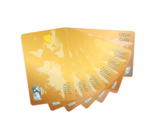 Golden plastic credit cards on white background