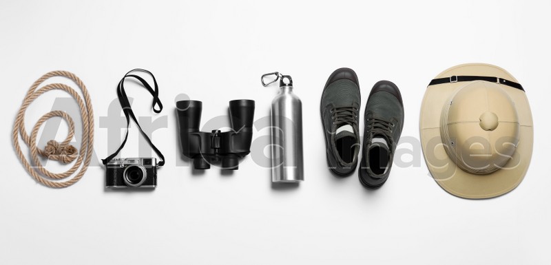 Flat lay composition with different safari accessories on white background