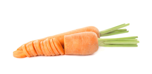 Whole and cut ripe carrots isolated on white