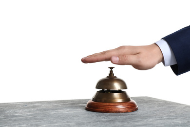 Man ringing hotel service bell at grey stone table