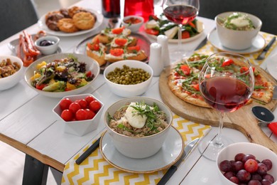 Photo of Many different dishes served on buffet table for brunch