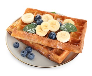 Photo of Delicious Belgian waffles with blueberries and banana on white background