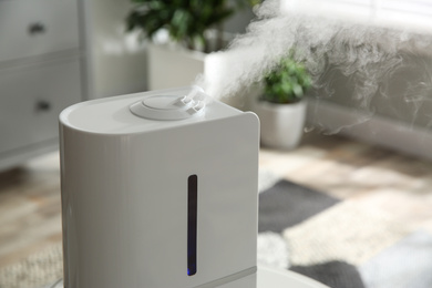 Modern air humidifier at home, closeup view