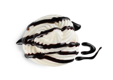 Delicious fresh whipped cream with chocolate syrup isolated on white, top view