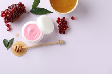 Photo of Composition with natural homemade mask, pomegranate and ingredients on white background, top view