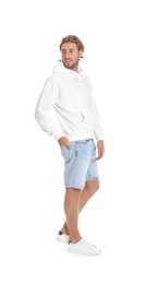 Photo of Full length portrait of man in hoodie sweater on white background. Space for design