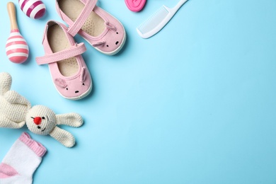 Flat lay composition with baby accessories and toys on color background. Space for text