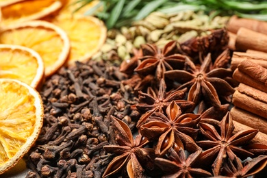 Different mulled wine ingredients as background, closeup