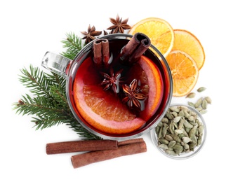 Aromatic mulled wine and ingredients on white background, top view