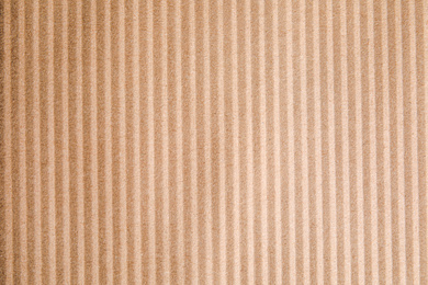 Brown corrugated sheet of cardboard as background, top view