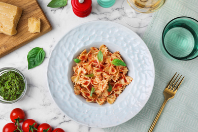 Flat lay composition with tasty pasta on white marble table