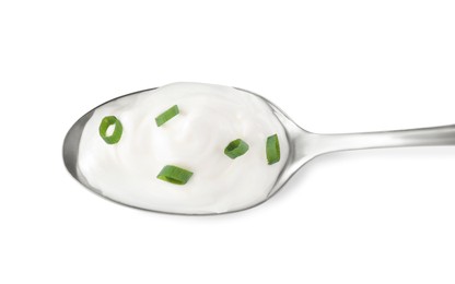 Delicious sour cream with onion in spoon on white background, top view