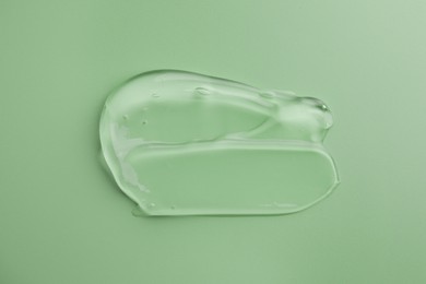 Photo of Sample of gel on green background, top view