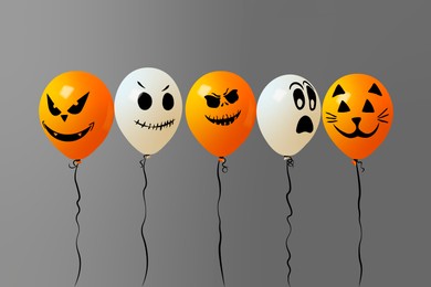 Color balloons for Halloween party on gray background. Vector illustration