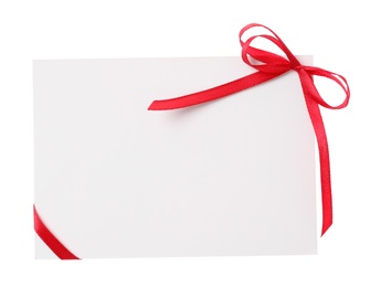 Blank card with red bow on white background, top view. Valentine's Day celebration