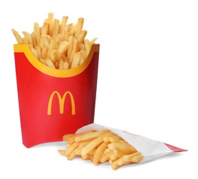 MYKOLAIV, UKRAINE - AUGUST 11, 2021: Big and small portions of McDonald's French fries on white background