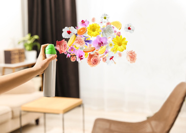 Image of Woman spraying air freshener at home, closeup. Flowered aroma