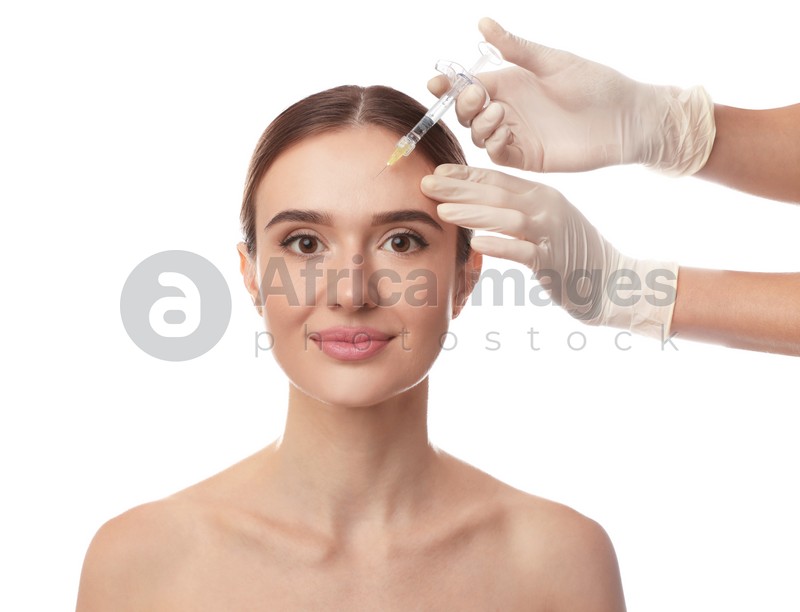 Beautiful woman getting facial injection on white background. Cosmetic surgery