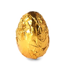 Chocolate egg wrapped in golden foil isolated on white