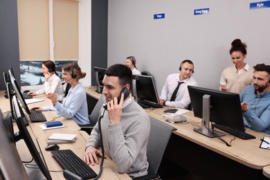 Call center operators working in modern office