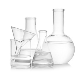 Laboratory glassware with transparent liquid on white background