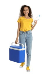 Happy young African American woman with cool box and bottle of water on white background