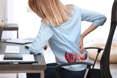 Woman suffering from kidney pain in office