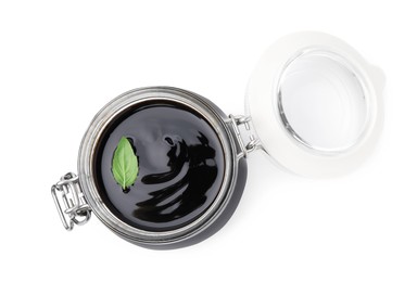 Photo of Glass jar with balsamic glaze isolated on white, top view