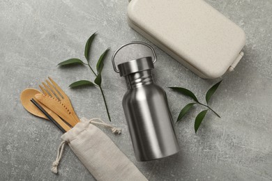 Flat lay composition with eco friendly products on grey background. Conscious consumption