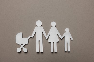 Paper family figures on light grey background, top view. Insurance concept