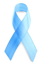 Photo of Light blue ribbon isolated on white, top view. World Cancer Day