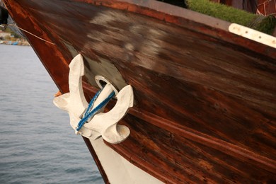 Photo of Huge and massive anchor of modern yacht near sea