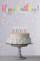 Happy Birthday! Delicious cake with burning candles on white table 
