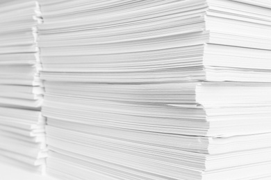 Stacks of white paper sheets, closeup view