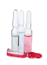 Glass ampoules with pharmaceutical products on white background