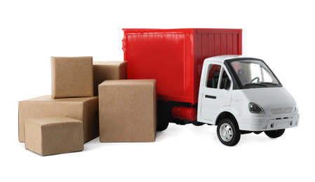 Toy truck with boxes isolated on white. Logistics and wholesale concept