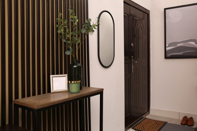 Modern hallway interior with console table and mirror