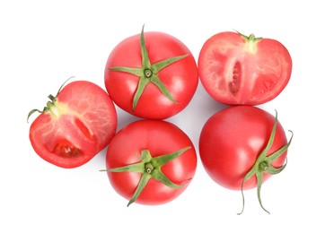 Whole and cut red tomatoes on white background, top view