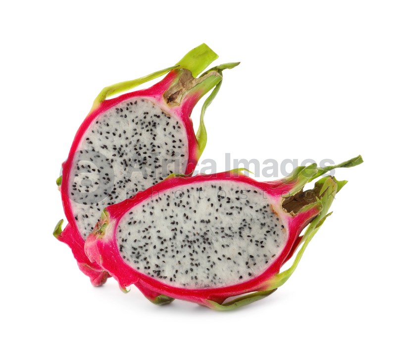 Photo of Halves of delicious dragon fruit (pitahaya) on white background