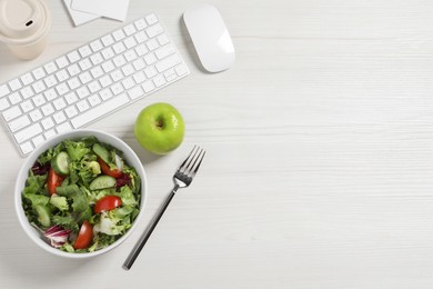 Photo of Bowl of tasty food, keyboard, apple and fork on white wooden table, flat lay with space for text. Business lunch