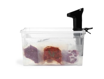Thermal immersion circulator and meat in box on white background. Vacuum packing for sous vide cooking