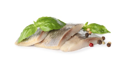 Delicious salted herring slices with basil and peppercorns on white background